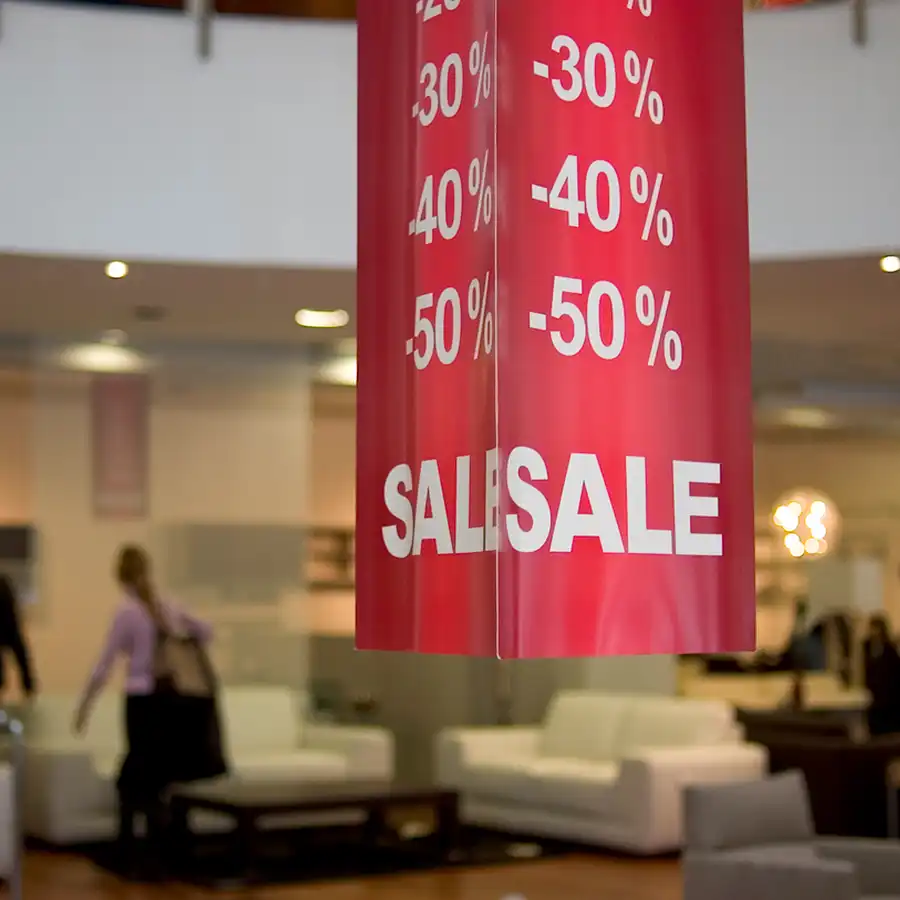 A large display informing about discounts in a home furnishings store.